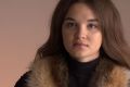 Женские жилеты из меха енота